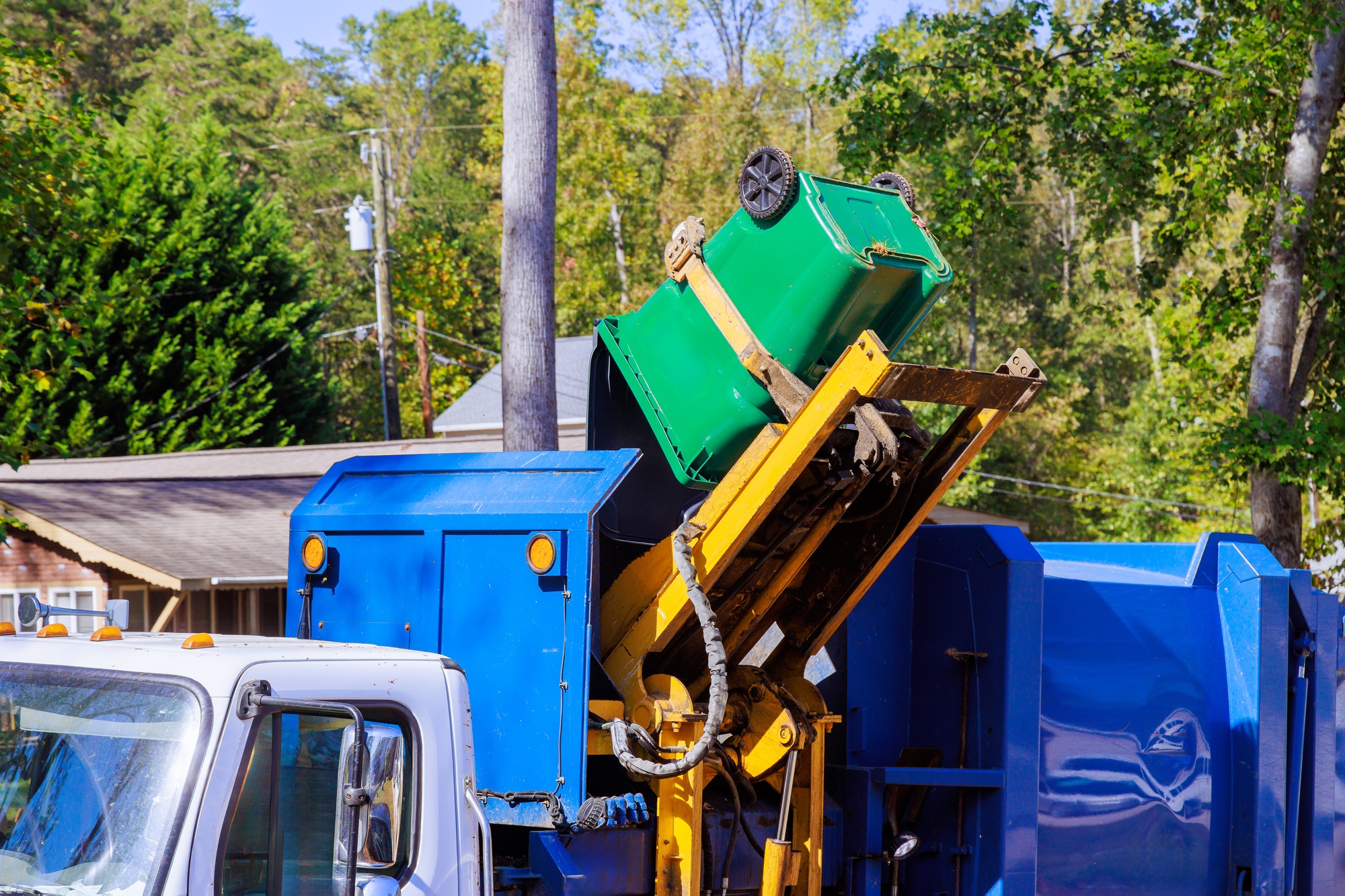 Municipal cleaning service removal garbage by means of loading mixed domestic waste to a garbage